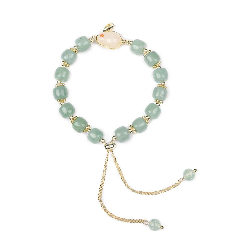 Natural stone rabbit bracelet with green aventurine and strawberry quartz beads, copper plating and gold accents