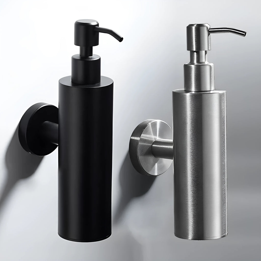 Stainless steel wall-mounted manual soap dispenser with a brushed metal finish.