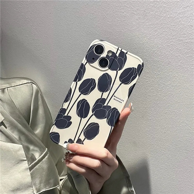 Black silicone iPhone case with intricate cold wind tulip pattern design on back cover