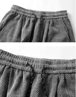 Man's straight-leg fleece-lined casual trousers in black, shown with elastic waistband detail.
