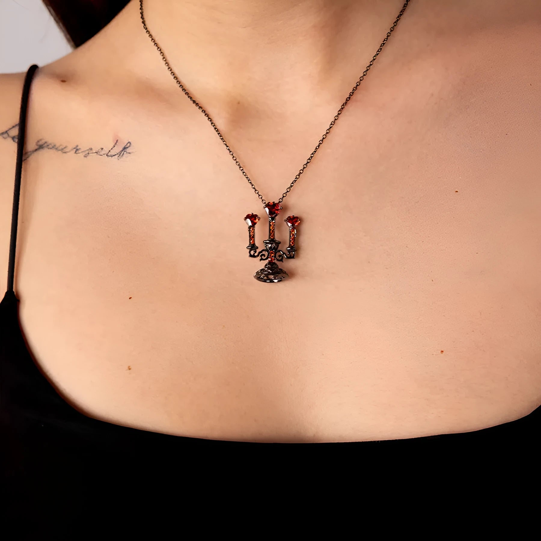 Women's Gothic necklace with detailed hollow candlestick pendant on cross chain