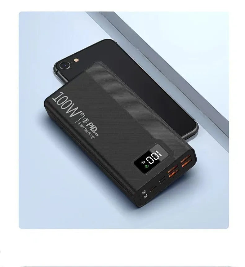 Large capacity power bank in black or white plastic casing with dimensions 150mm x 76mm
