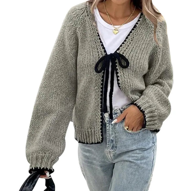 Lace-up front cardigan sweater with crocheted flower detail in solid colour