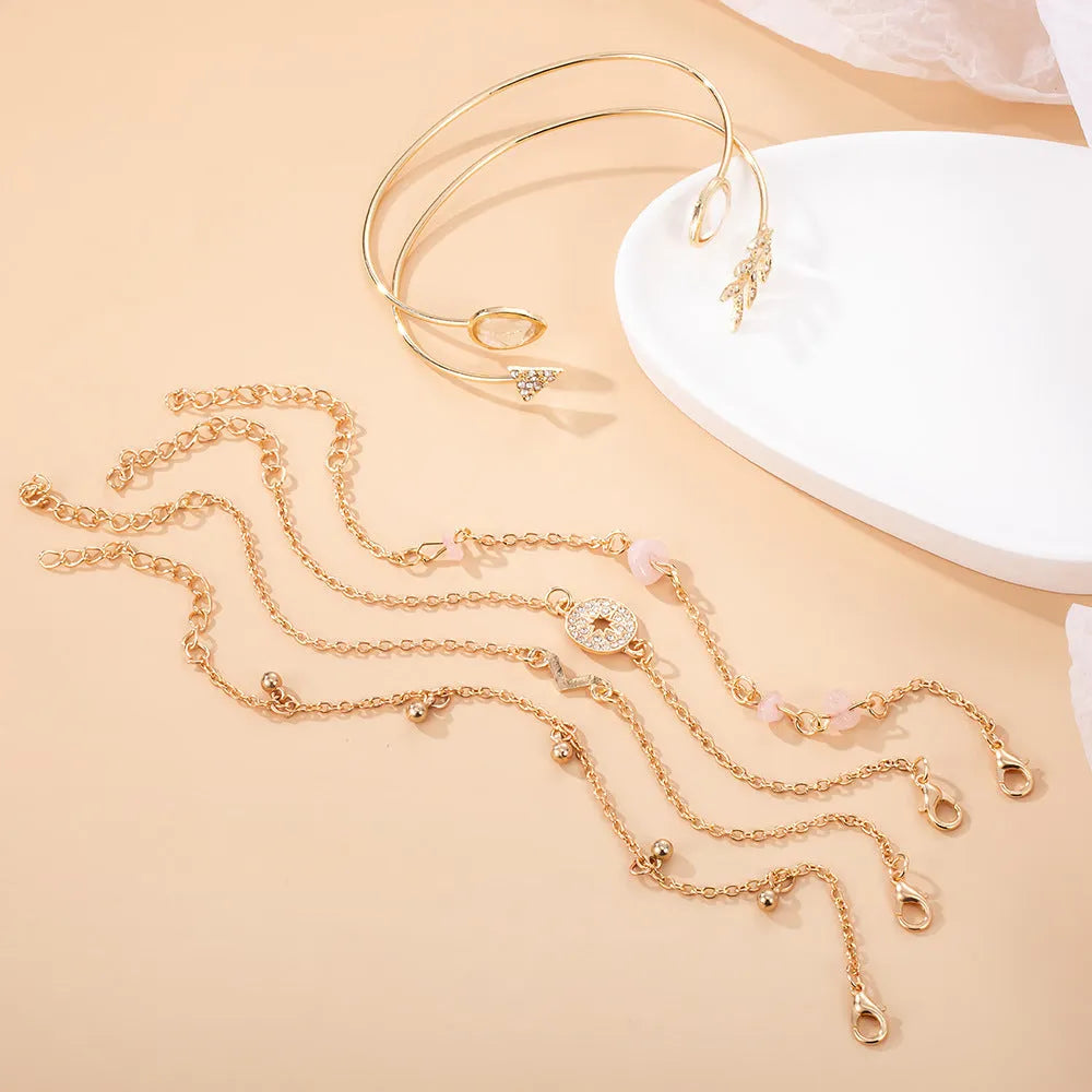 Women's gold jewellery bracelet set with arrow and water drop shapes on zinc alloy