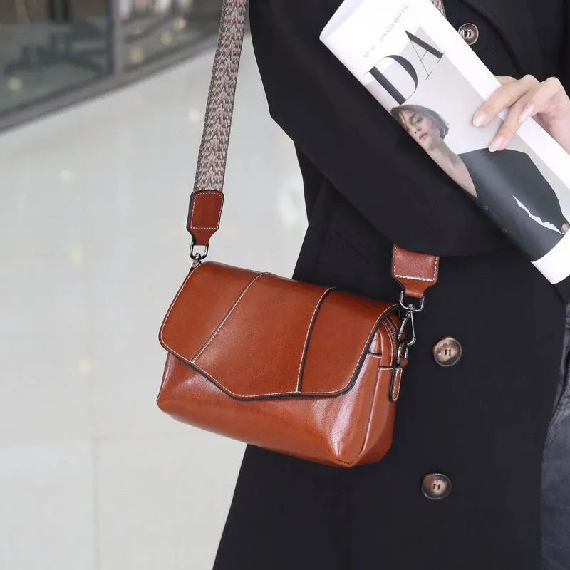 Top grain leather crossbody bag for women in caramel colour with zip closure and patchwork design