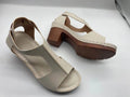 Roman style women's wedge sandals with open peep toe, buckle detail, and a low heel, shown in multiple colours.