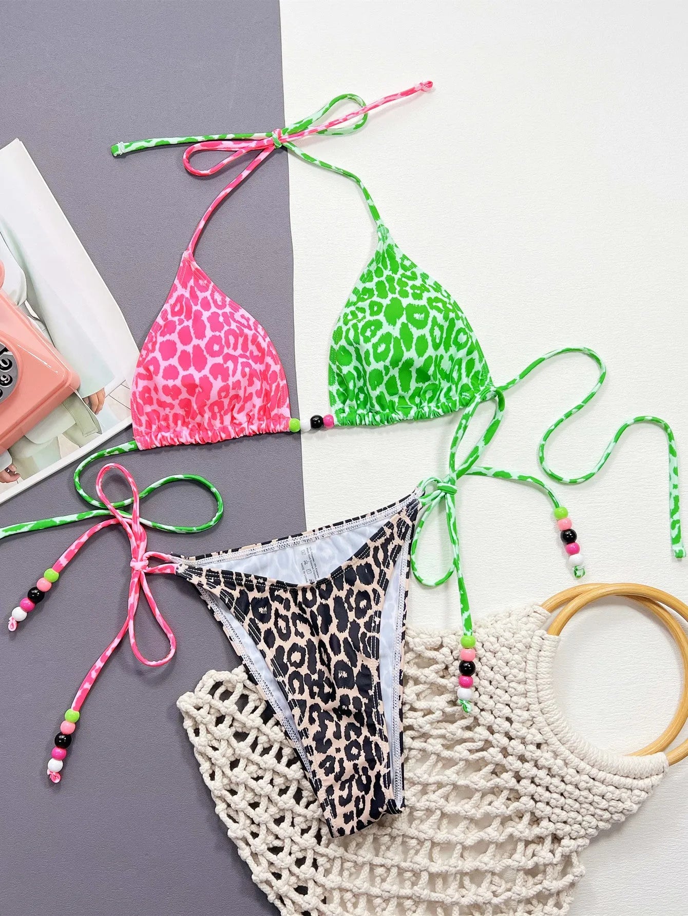 Women's leopard print bikini swimsuit with bra and briefs on a mannequin.
