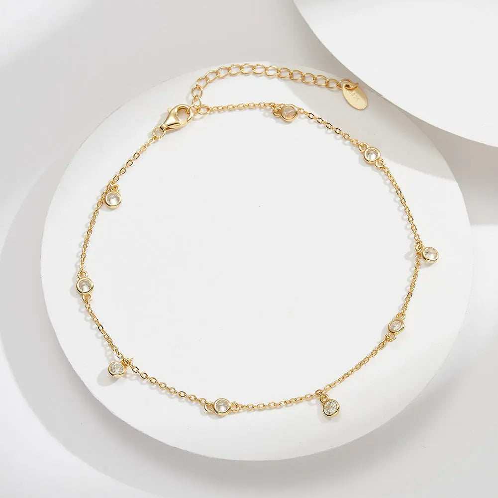 Women's silver anklet with geometric zirconium pendant in gold or platinum finish on adjustable chain