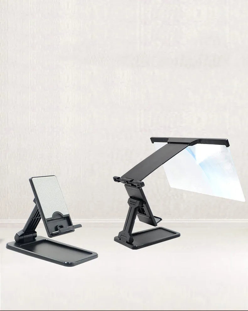 Black mobile phone screen amplifier with detachable phone holder on desktop surface