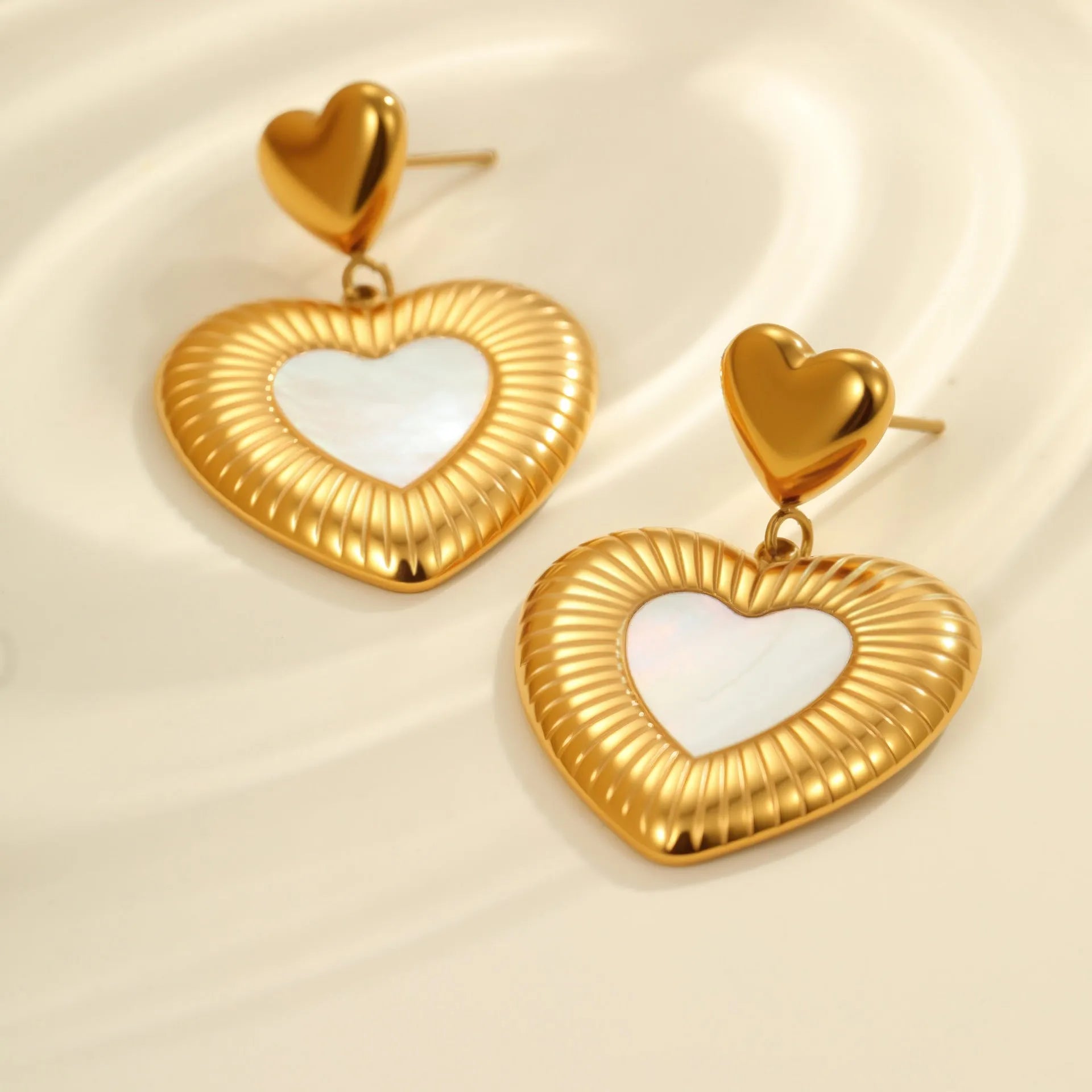 Heart-shaped stainless steel earrings with 18K gold electroplating in gold colour