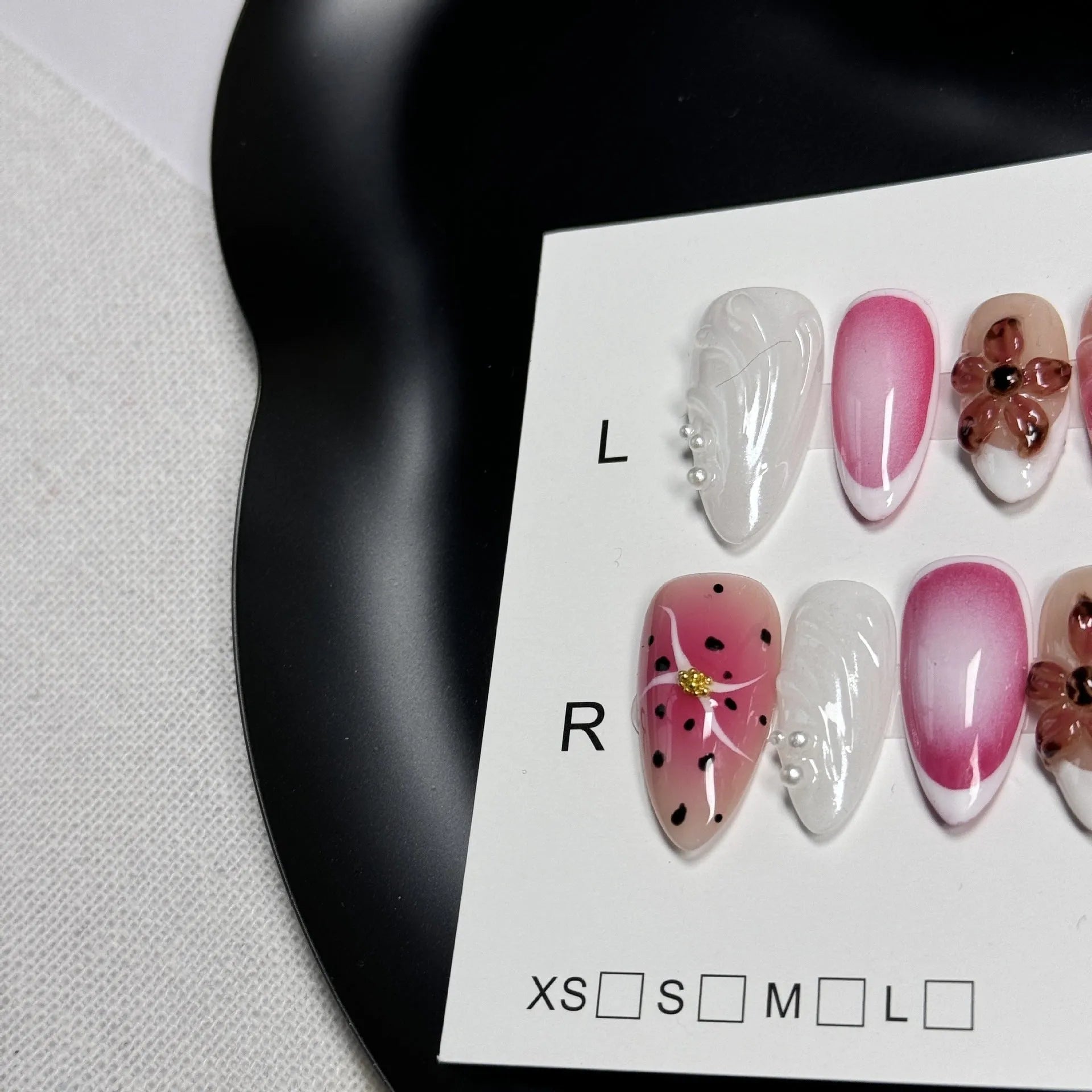 Three-dimensional carved nail art patches with hand-painted designs for almond-shaped nails