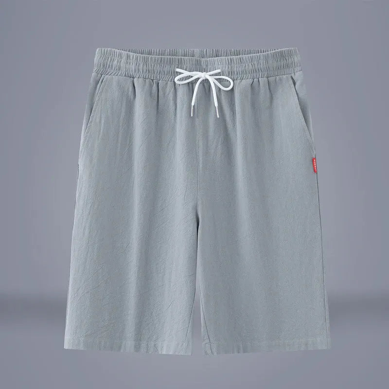 Solid colour cotton linen cropped trousers with a drawstring waist in Army Green