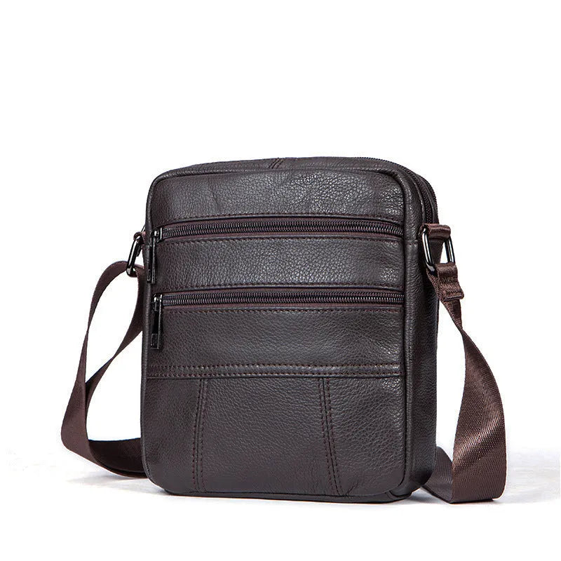 Men's vintage cowhide leather shoulder bag showing vertical square shape and internal organisation pockets