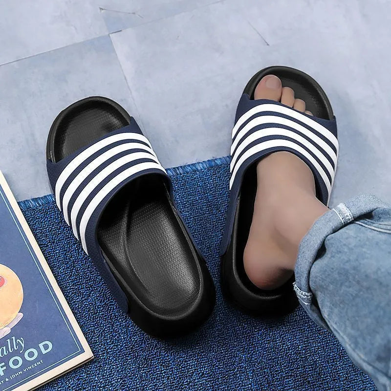 A pair of casual unisex slippers with a PVC upper and EVA sole, shown in a selected colour.