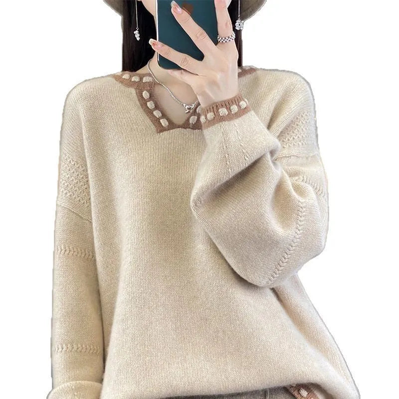 Camel coloured women's V-neck viscose pullover sweater with long sleeves on a hanger.
