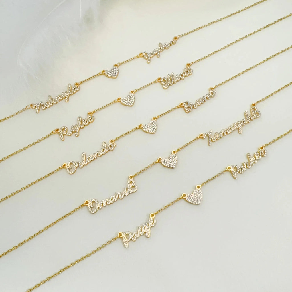 Customised diamond inlaid multi name necklace on stainless steel O-shaped chain, gold finish, with heart charms