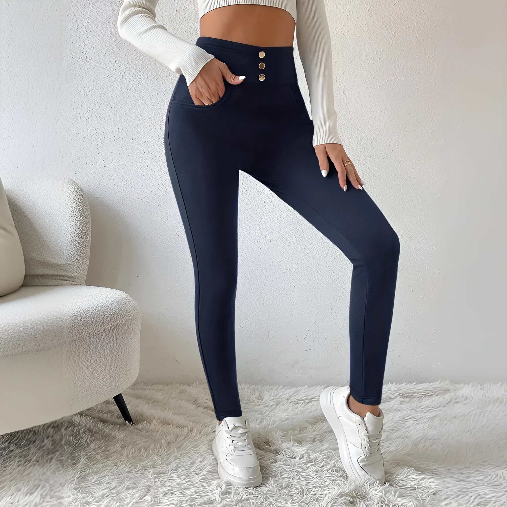 Navy blue women's trousers with high waist and straight leg design on hanger