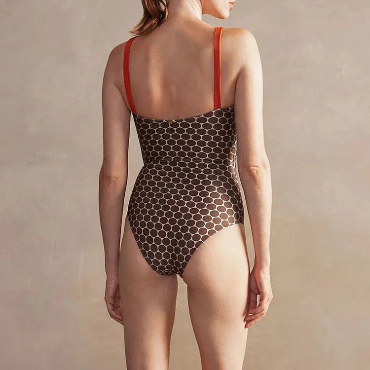 Women's printed one-piece swimsuit with dots pattern and matching wrap skirt