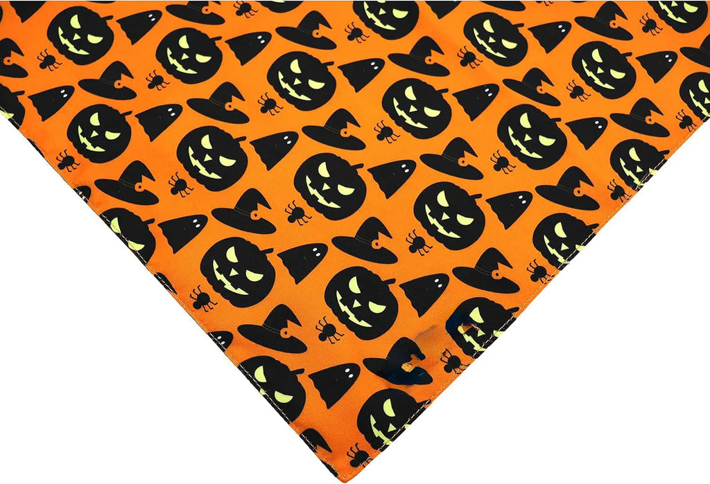 Black and orange reversible Halloween dog bandana with pumpkin and spider web patterns, adjustable for necks up to 16 inches