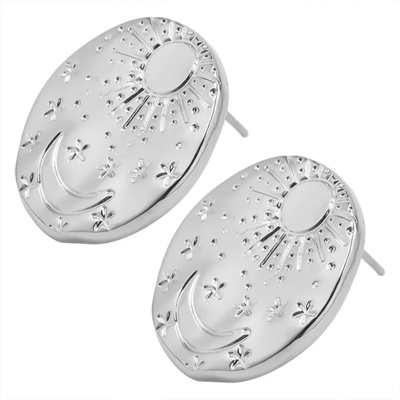 Pair of geometric stud earrings with shell design in gold or silver finish on a white background.