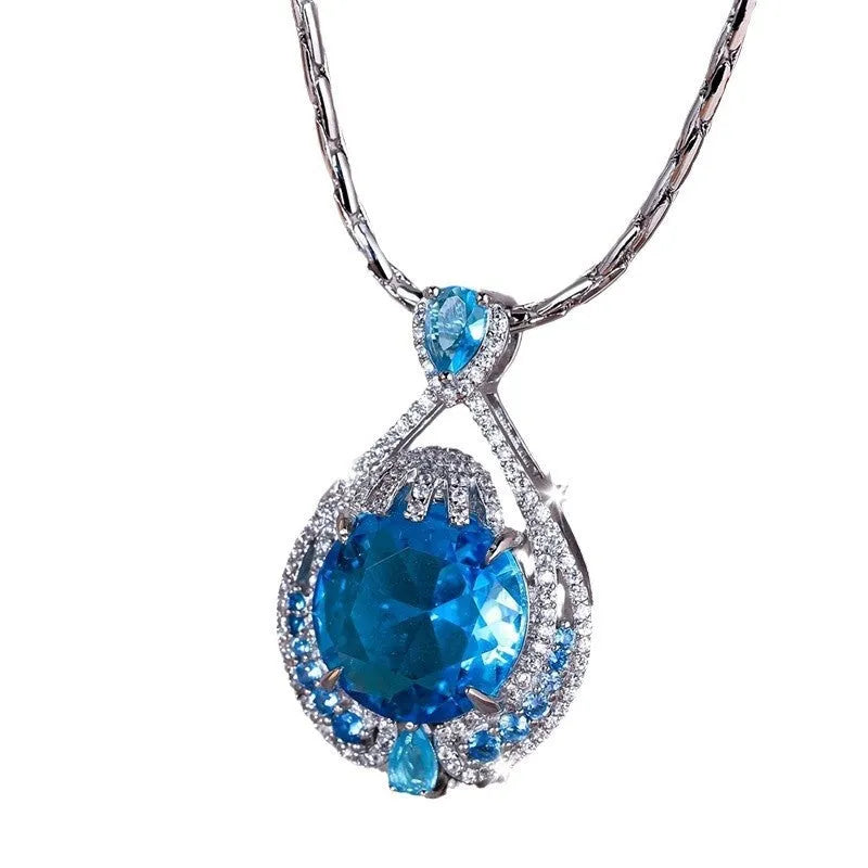 Blue geometric pendant necklace with fireworks cut crystal gems on water wave chain