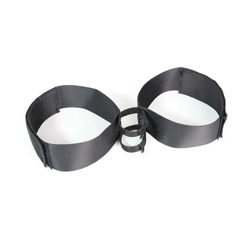 Black knitted sex toy strap for women showing adjustable appliance accessory design