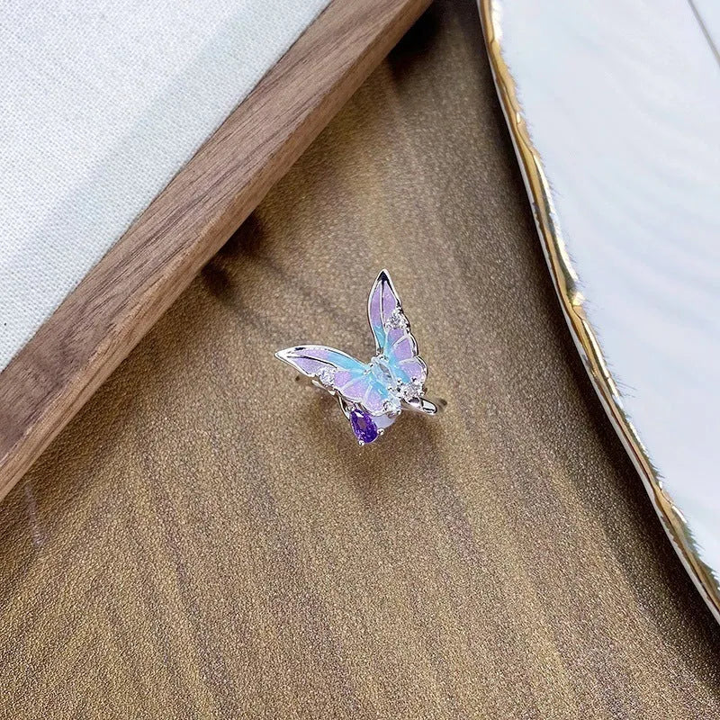 Copper insect fashion ring with an adjustable opening in one of three colour finishes.