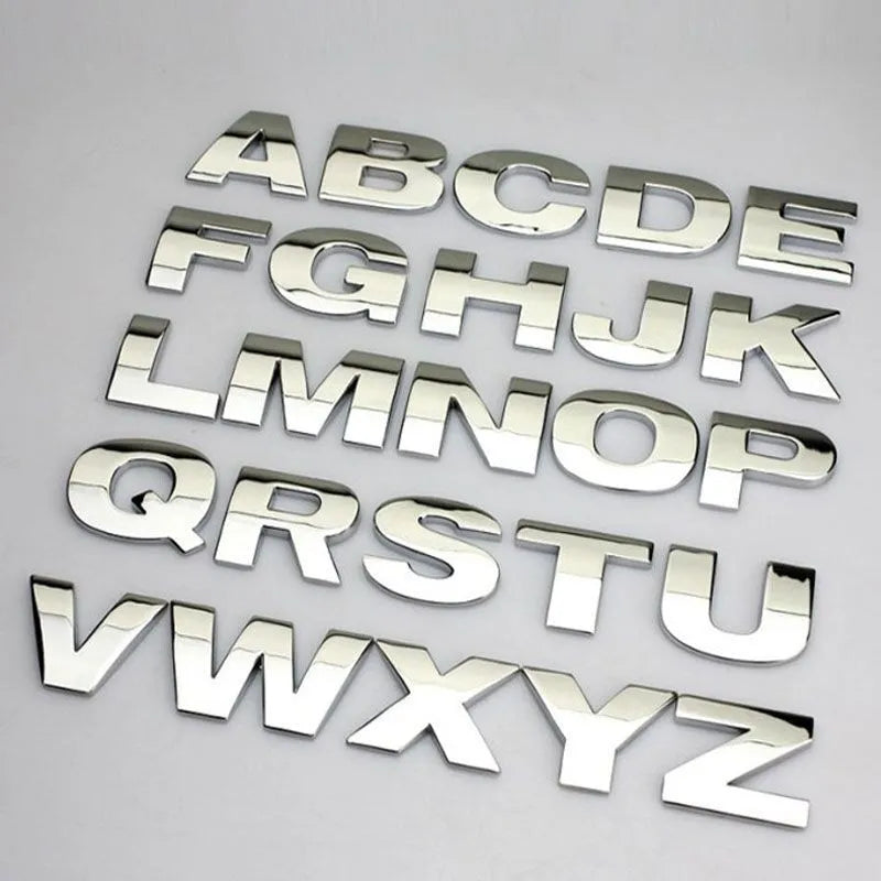 Metal zinc alloy car bumper sticker showing 2.5cm English letter on black background