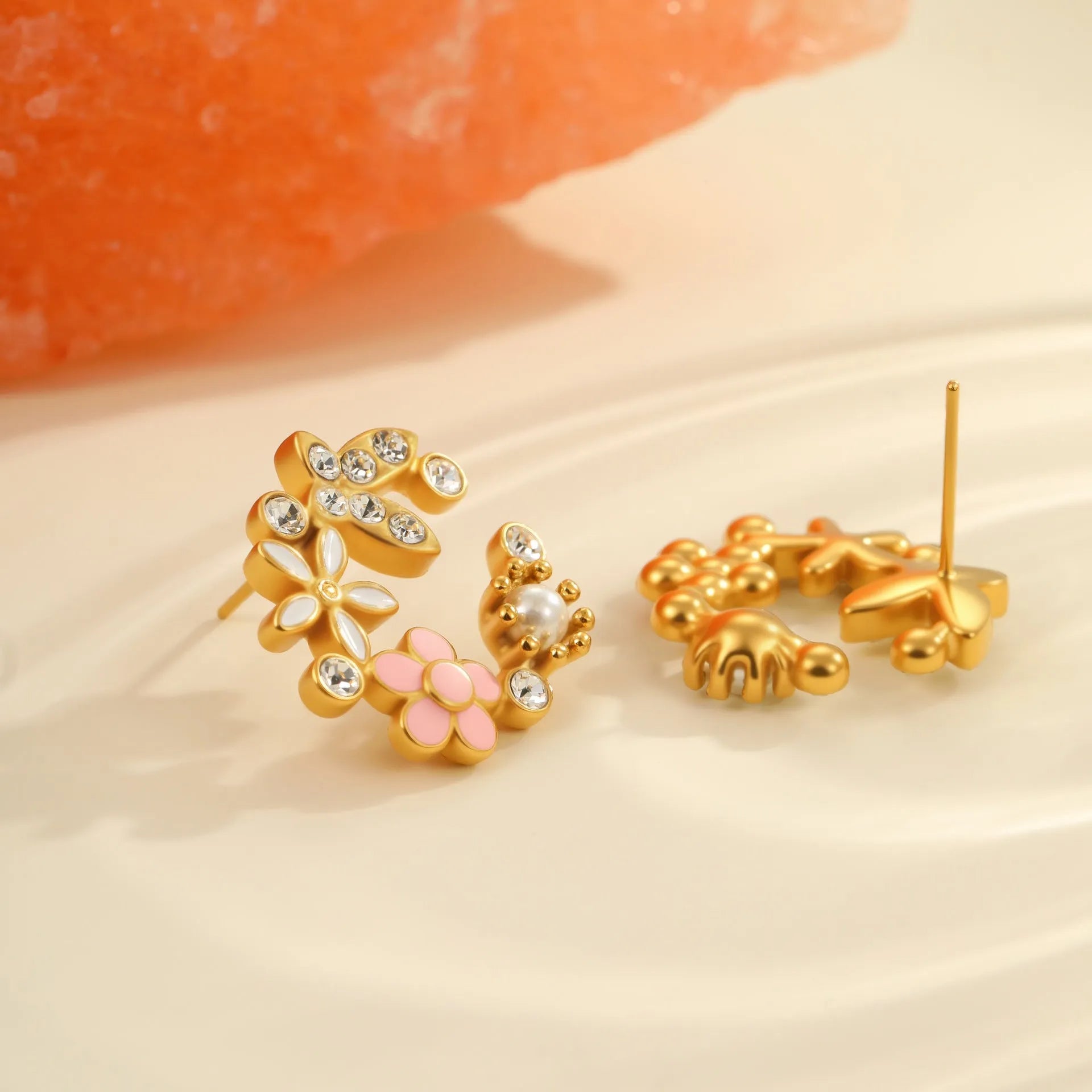 Flower stud earrings with petal design in gold electroplated finish on stainless steel