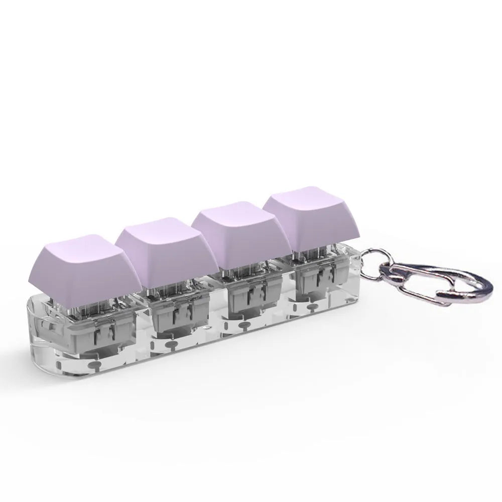 Compact 4-key mechanical keyboard switch tester on a desk, showing coloured ABS plastic construction.