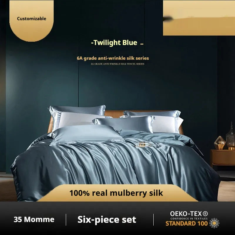 Solid colour silk four-piece quilt cover set shown in Champagne Gold on a bed