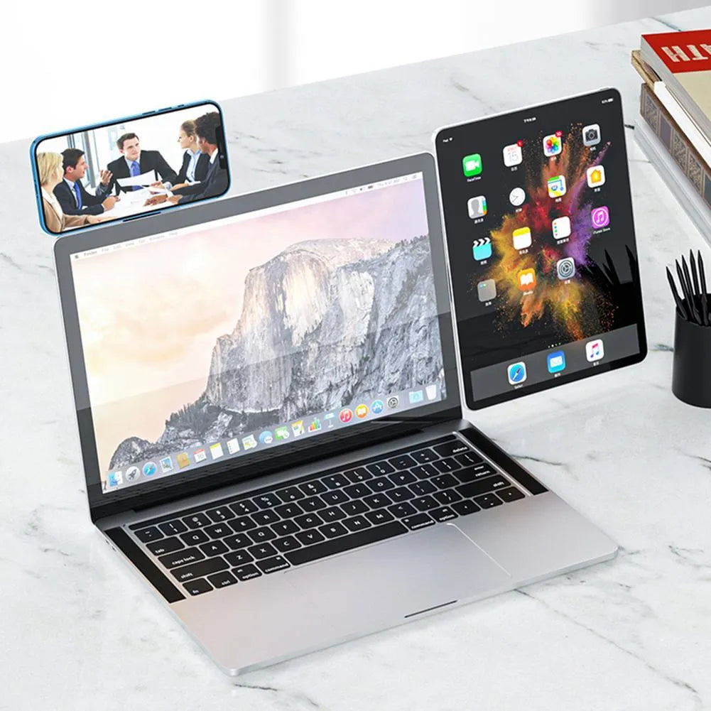 Black aluminium laptop phone holder with magnetic mount attached to monitor