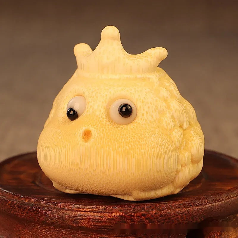 Solid bamboo carving of a Crown Princess Toad ornament with live eye design.