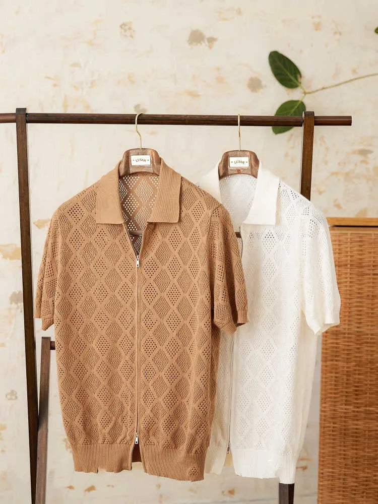 Light brown cotton short sleeve cardigan with lapel collar and front zipper on a hanger.