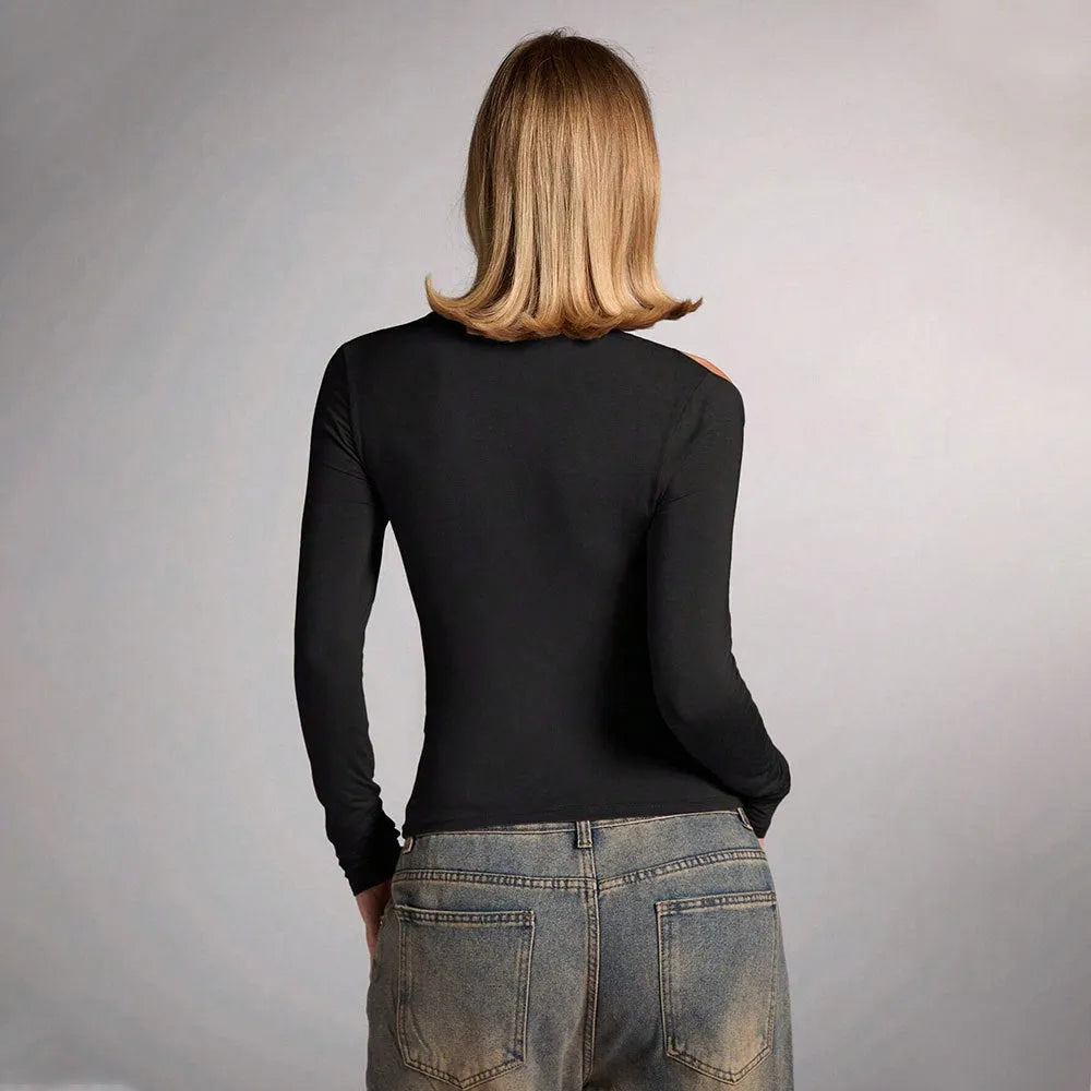 Black women's slim fit halter neck cropped top on a model, showing the sleeveless shoulder-baring design.