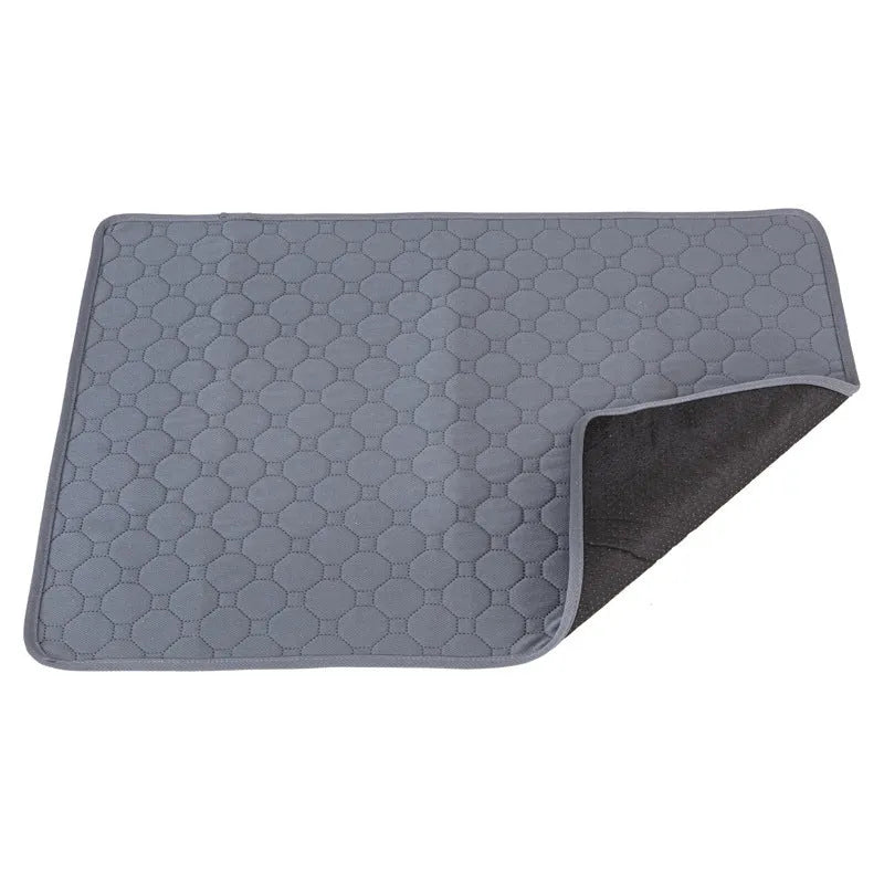 Washable dog pee pads in grey and tan colours showing multi-layer construction and triple-stitch binding