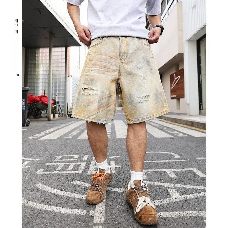 Light blue men's denim shorts with a washed finish and ripped detailing on a straight-leg cut.