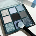 MUGELEEN nine-colour eye shadow palette showing low saturation blue smoked shades with matte and shimmer finishes