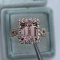 Geometric rose gold coloured alloy ring for women and men on a grey background.