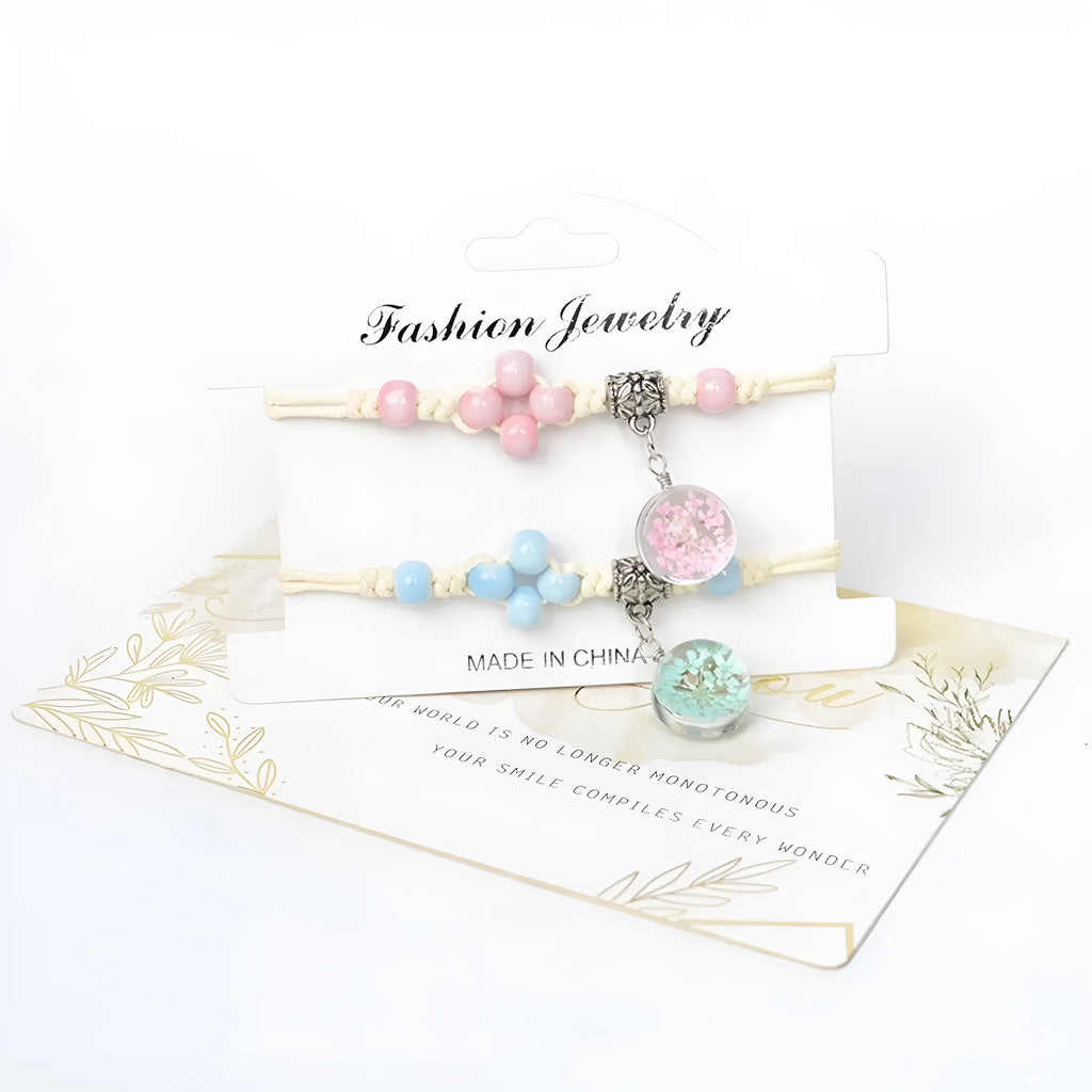 Glass dried flower bracelet with large 1.4cm beads containing real preserved flowers, in a hand-woven design.
