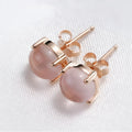 Women's rose gold drop shape stud earrings with crystal inlay detail