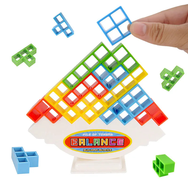 Plastic balance stacking game with 16 colourful building blocks, chassis and base on table