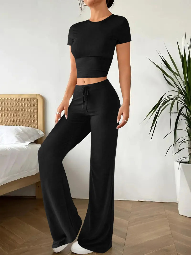 Black polyester trouser suit set with high-waisted trousers and short sleeve V-neck top