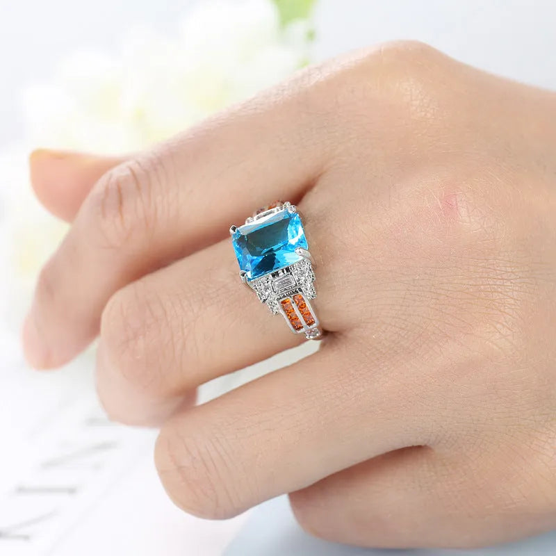 Ocean blue zircon copper ring with geometric shape and electroplated finish in women's sizes No 6 to No 10
