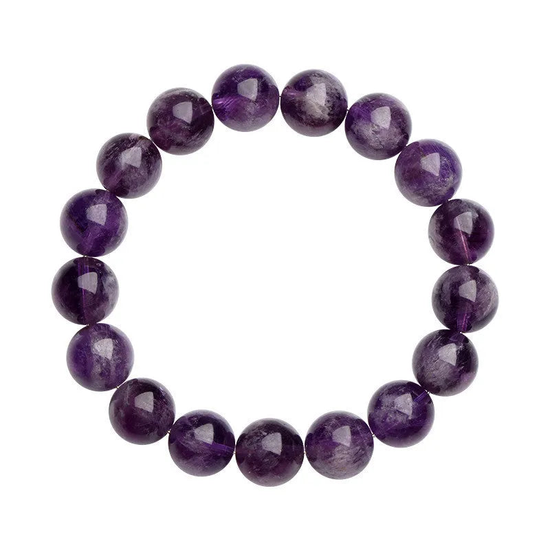 Snow Mountain feather amethyst crystal bracelet with geometric beads and Ruyi elements on a wrist.