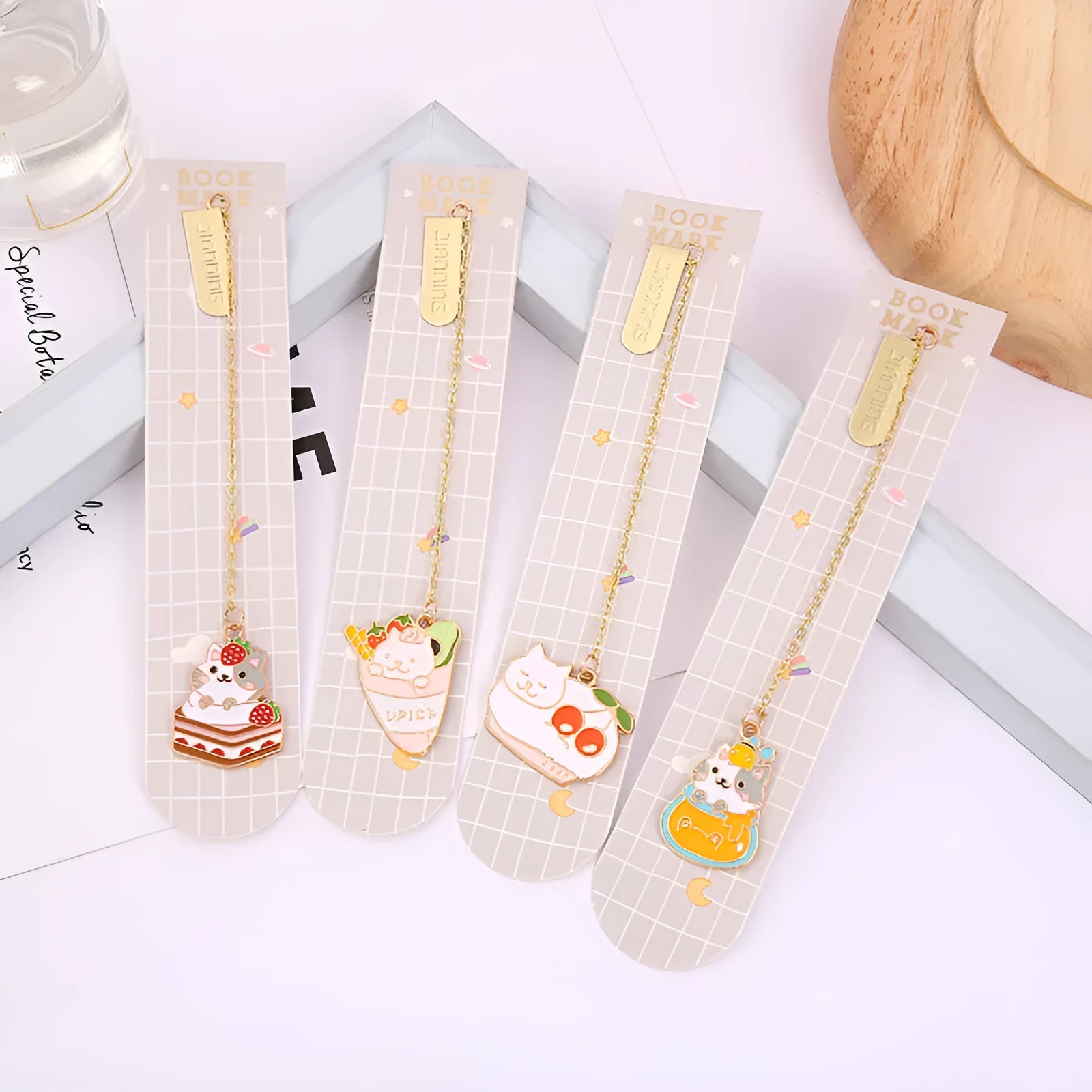 Metal bookmark pendant with a cartoon cat design, options include strawberry cake cat and sleeping cat styles.