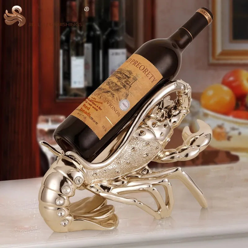 Rose gold and silver lobster-shaped plastic and resin wine rack ornament on a tabletop.