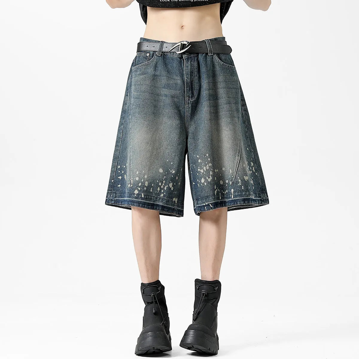 Men's retro blue denim shorts with ripped detailing and splash ink patterns in straight cut design