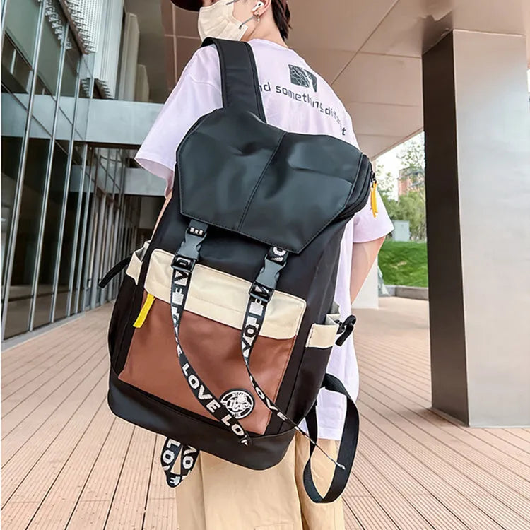 Oxford cloth backpack in black showing handheld, shoulder, and dual-strap carrying options.