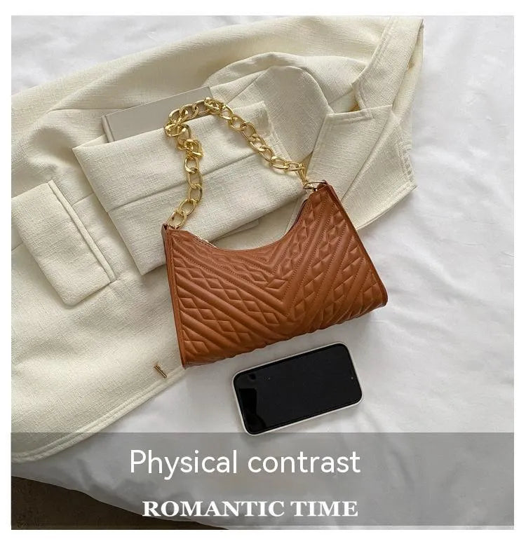 Brown pleated chain strap baguette shoulder bag with a vertical square shape and soft carry handle.